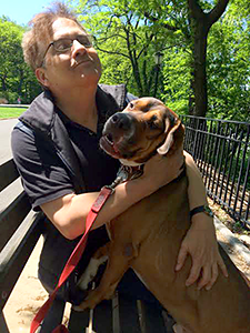 Waggin' Train Rescue adoptee, Alfie, enjoys a summer day in Riverside Park with his adopter, Ken. (Photo by Jane Kleinsinger)