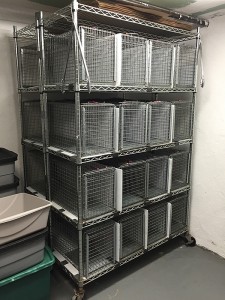 A rolling baker's rack allows you to maximize the number of TNR traps you can fit into a small holding space. (Photo by NYCFCI)