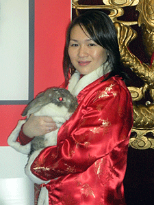 Helen Chen, Rabbit Rescue & Rehab/AC&C volunteer, holding an adoptable rabbit from Animal Care & Control of NYC (AC&C).