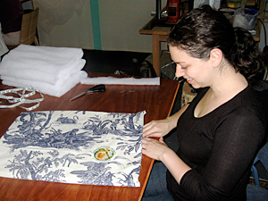 Volunteer Michelle Aptman stiches up a comforter at the Mother's Comfort Project sewing event on November 17.