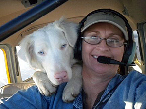 Rescued dog Newman gets comfortable in the cockpit with Pilots N Paws pilot Rhonda Miles en route to his new home. (Photo by Rhonda Miles)